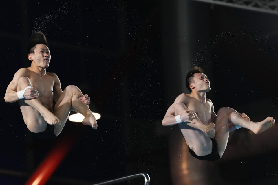 Lian Junjie and Yang Hao of China compete during the Men's synchronized 10m platform diving final at the World Aquatics Championships in Doha, Qatar, Thursday, Feb. 8, 2024. (AP Photo/Hassan Ammar)