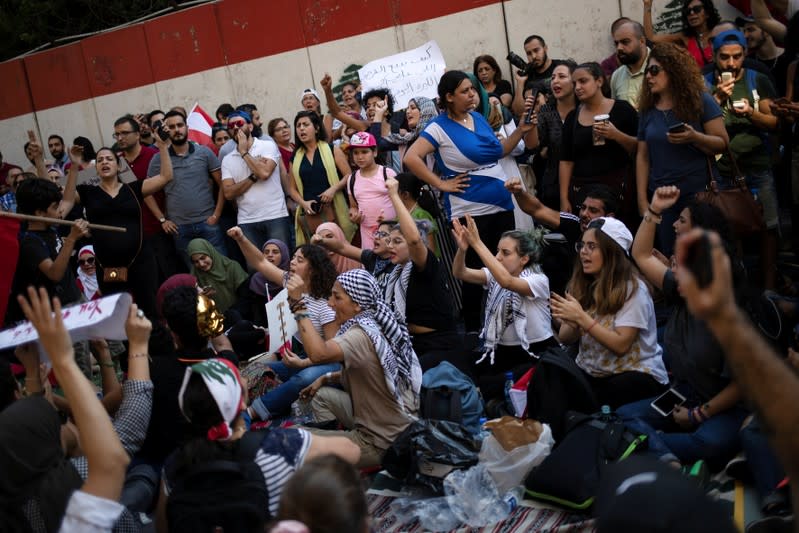 Demonstrators shout slogans during an anti-government protest outside the Central Bank of Lebanon in Beirut