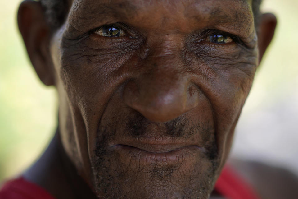 A local Rastafari farmer rests in the shade of a fruit tree on the sacred property of the Ras Freeman Foundation for the Unification of Rastafari, Saturday, May 13, 2023, in Liberta, Antigua. (AP Photo/Jessie Wardarski)