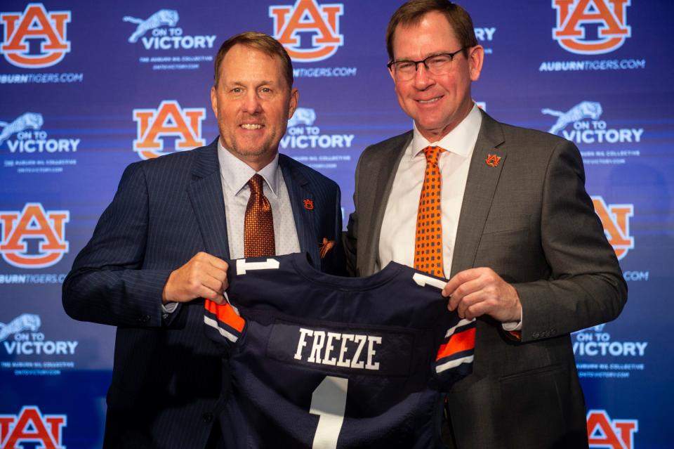 Auburn Tigers football coach Hugh Freeze and athletic director John Cohen pose for photos during Freeze’s introduction at the Woltosz Football Performance Center in Auburn, Ala., on Tuesday, Nov. 29, 2022 Jake Crandall / USA TODAY NETWORK