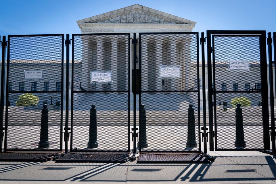 Anti-scaling fencing blocks off the stairs to the Supreme Court, Tuesday, May 10, 2022, in Washington.