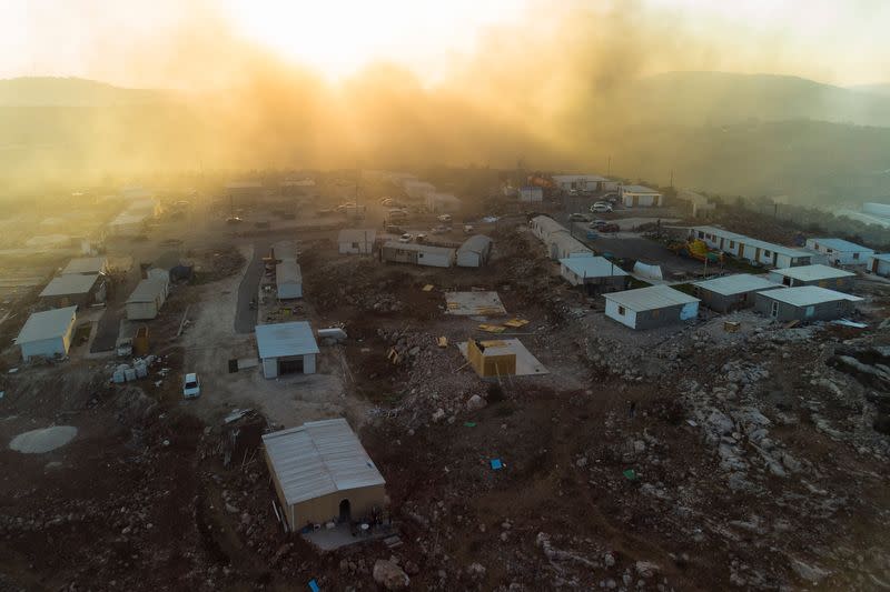 Lasers and bonfires light up battle over new Israeli settlement