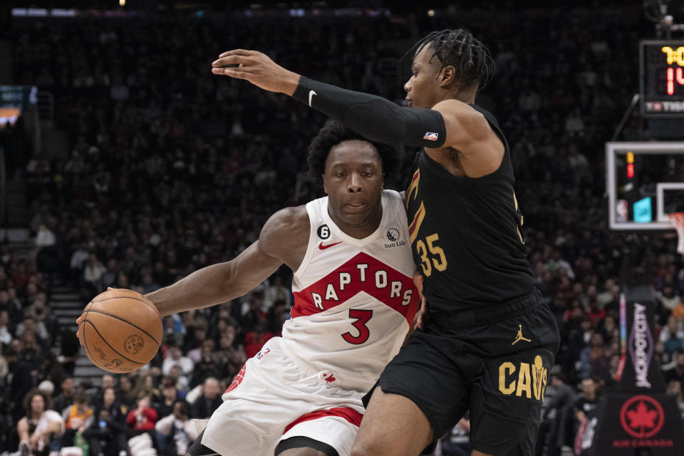 Toronto Raptors' O.G. Anunoby (3) drives at Cleveland Cavaliers' Isaac Okoro during the first half of an NBA basketball game in Toronto, Monday, Nov. 28, 2022. (Chris Young/The Canadian Press via AP)