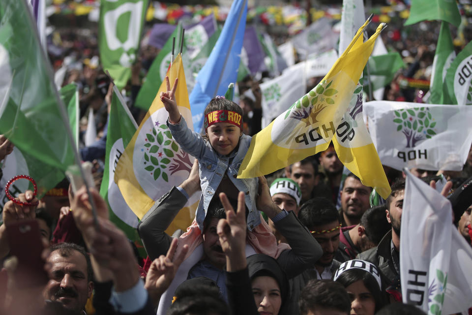 Thousands of supporters of pro-Kurdish Peoples' Democratic Party, or HDP, gather to celebrate the Kurdish New Year and to attend a campaign rally for local elections that will test the Turkish president's popularity, in Istanbul, Sunday, March 24, 2019. The HDP held the event amid the municipal office races that have become polarizing and a government crackdown on its members for alleged links to outlawed Kurdish militants. (AP Photo/Emrah Gurel)