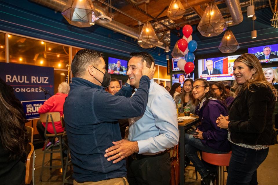 Congressman Raul Ruiz, M.D. (CA-36), candidate for the new 25th Congressional District, talks to Humberto Beto Alvarez, a Desert Sands Unified School District board candidate, inside Sayulita Tap Room in Indio, Calif., on Tuesday night, Nov. 8, 2022.