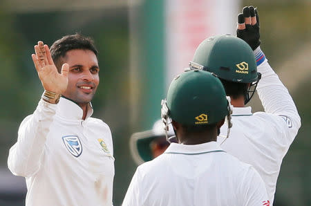 Cricket - Sri Lanka v South Africa - Second Test Match - Colombo, Sri Lanka - July 20, 2018 - South Africa's Keshav Maharaj (L) celebrates with his teammates after taking the wicket of Sri Lanka's Niroshan Dickwella. REUTERS/Dinuka Liyanawatte