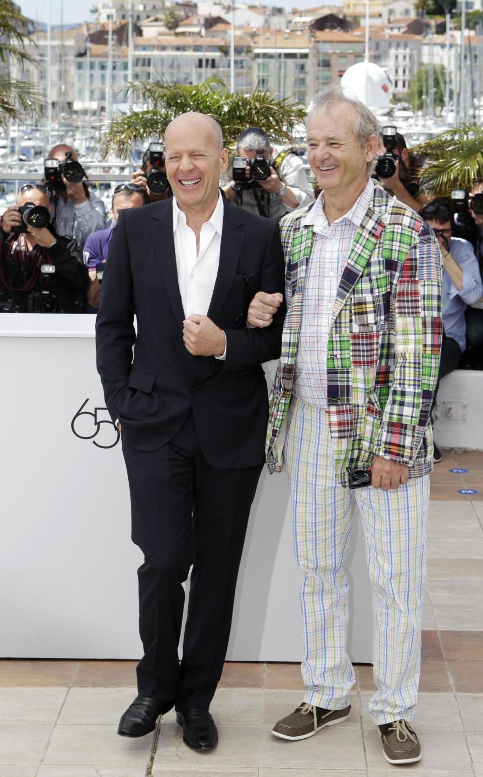 Actors Bruce Willis, left and Bill Murray pose during a photo call for Moonrise Kingdom at the 65th international film festival, in Cannes, southern France, Wednesday, May 16, 2012. (AP Photo/Lionel Cironneau)