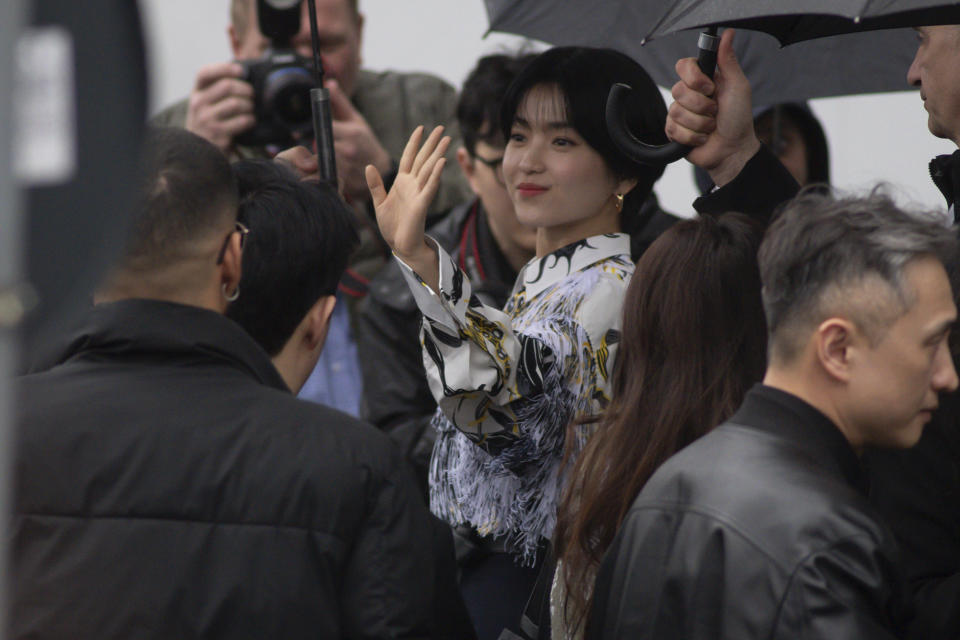 Kim Tae-ri waves as she arrives for the Prada Fall/Winter 2024-2025 collection in Milan, northern Italy, Thursday, Feb. 22, 2024. (Claudio Furlan/LaPresse via AP)