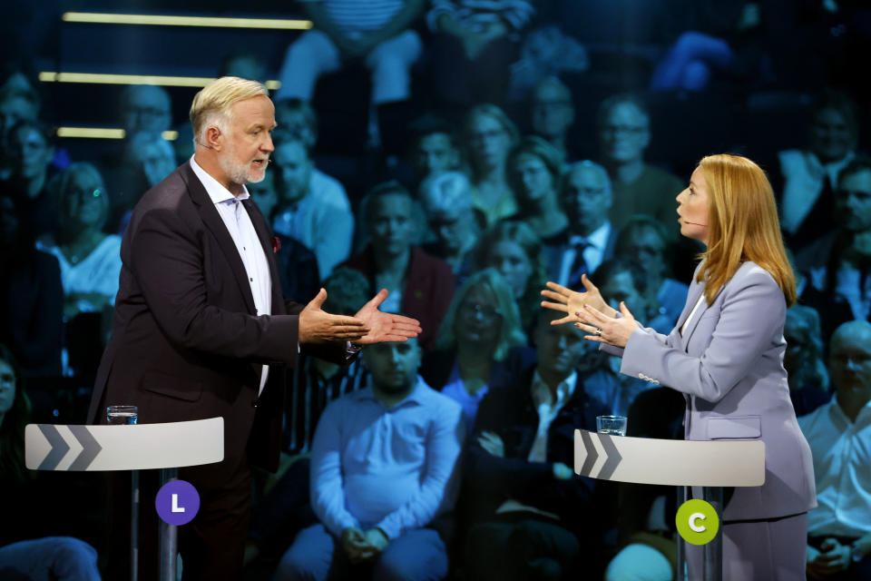 Johan Pehrson, leader of the Liberal party, and Annie Loof, leader of the Center party, take pary in a political debate broadcasted on TV4 from Eskilstuna, Sweden, Thursday Sept. 8, 2022. General elections will be held in Sweden on September 11. (Christine Olsson/TT via AP)