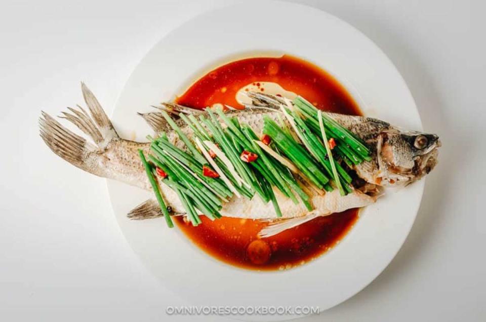 <p>Omnivore's Cookbook</p><p>Fish is believed to bring surplus and wealth.</p><p><strong>Get the recipe: <a href="https://omnivorescookbook.com/recipes/authentic-chinese-steamed-fish" rel="nofollow noopener" target="_blank" data-ylk="slk:Chinese Steamed Fish;elm:context_link;itc:0;sec:content-canvas" class="link ">Chinese Steamed Fish</a></strong></p>