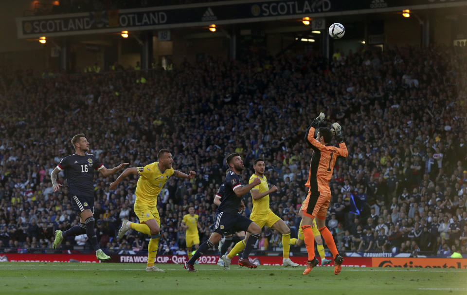 Ukraine's Andriy Yarmolenko, second left, scores his side's opening goal during the World Cup 2022 qualifying play-off soccer match between Scotland and Ukraine at Hampden Park stadium in Glasgow, Scotland, Wednesday, June 1, 2022. (AP Photo/Scott Heppell)