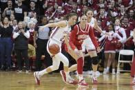 Indiana's Yarden Garzon (12) steals the ball from Ohio State's Rebeka Mikulasikova (23) during the second half of an NCAA college basketball game Thursday, Jan. 26, 2023, in Bloomington, Ind. (AP Photo/Darron Cummings)