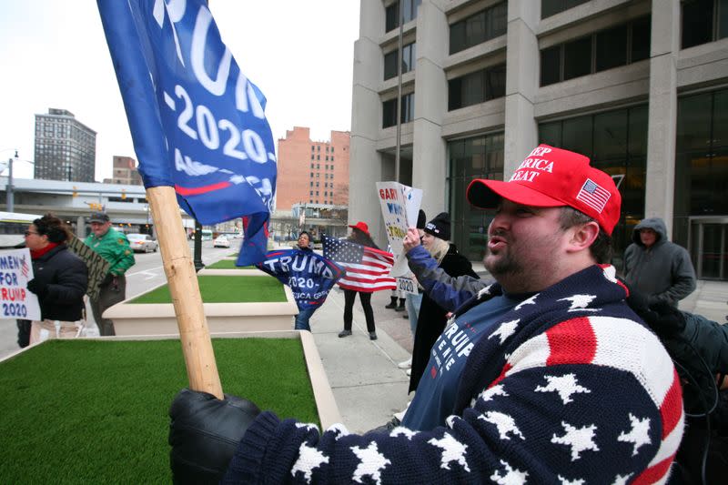 Ben Hirschmann gathers with other supporters of President Donald Trump to protest the U.S. Senate impeachment trial of the president, in downtown Detroit