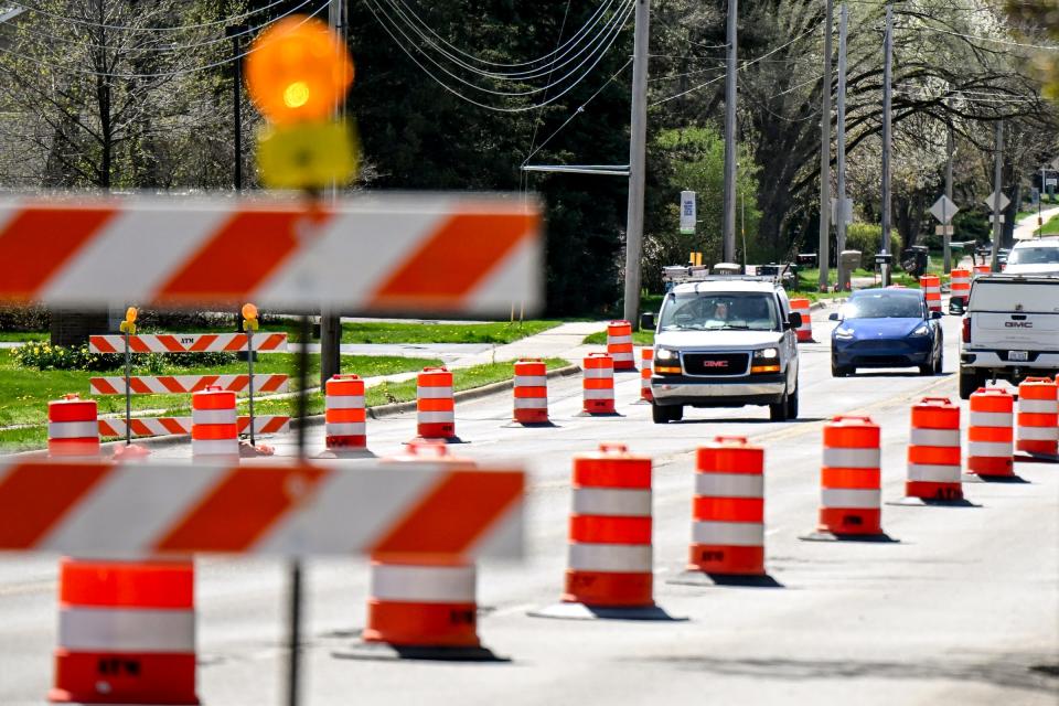 Traffic moves along on Coolidge Road as construction starts on the road on Tuesday, April 16, 2024, in East Lansing.