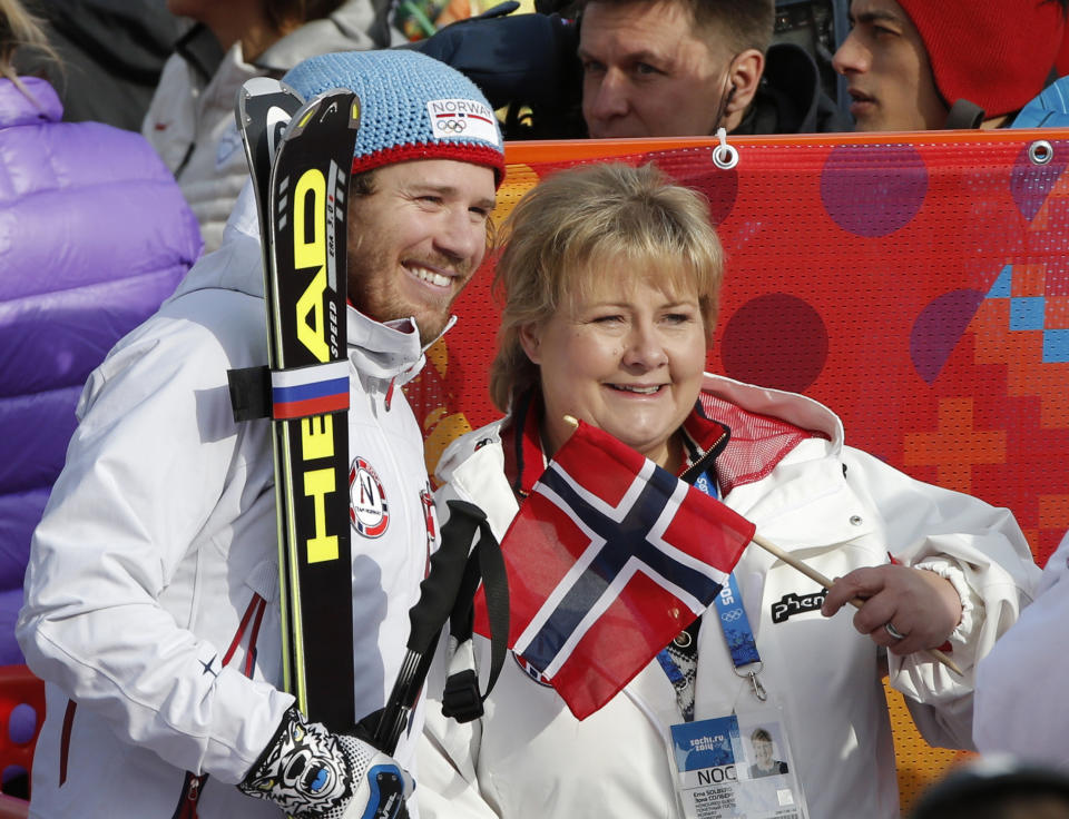 Norway's Kjetil Jansrud poses for a photograph with the Norwegian Erna Solberg after his finish in the men's super-G at the Sochi 2014 Winter Olympics, Sunday, Feb. 16, 2014, in Krasnaya Polyana, Russia. (AP Photo/Christophe Ena)