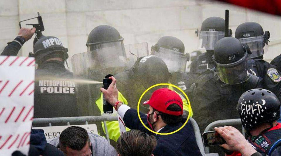 Edward Francisco Rodriguez uses bear spray against police officers outside the Capitol on Jan. 6, 2021. (Department of Justice)