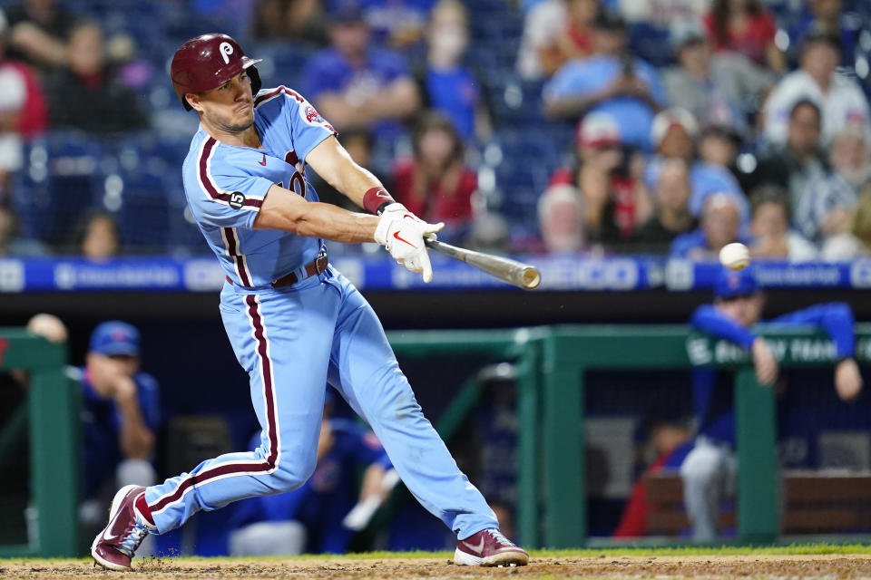 Philadelphia Phillies' J.T. Realmuto hits a two-run single against Chicago Cubs pitcher Kyle Hendricks during the fourth inning of a baseball game, Thursday, Sept. 16, 2021, in Philadelphia. (AP Photo/Matt Slocum)