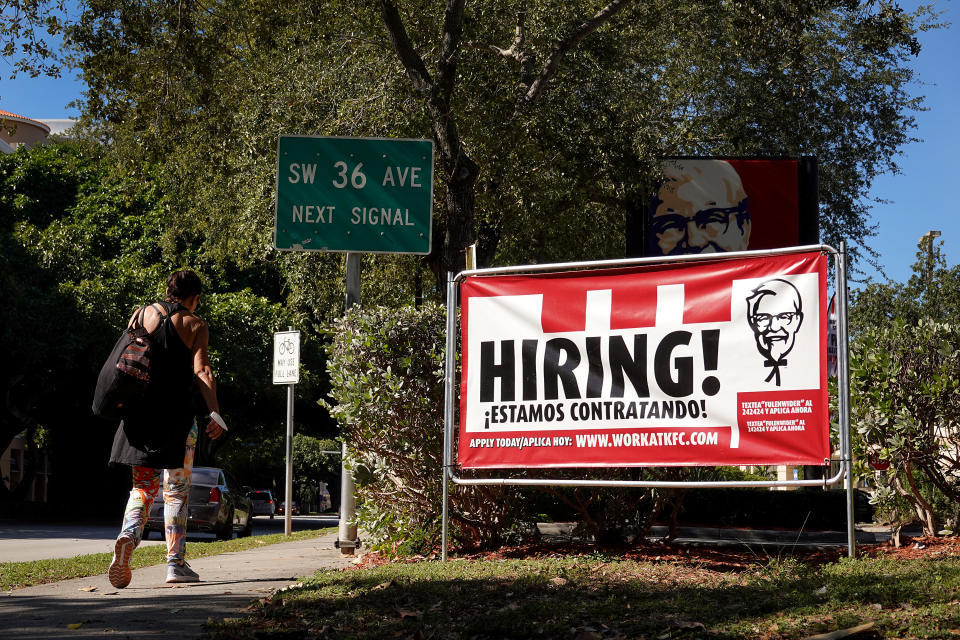 MIAMI, FLORIDA - DECEMBER 03:  A Hiring sign hangs in front of a KFC restaurant on December 03, 2021 in Miami, Florida.  The Labor Department announced that payrolls increased by just 210,000 for November, which is below what economists expected, though the unemployment rate fell to 4.2% from 4.6%.  (Photo by Joe Raedle/Getty Images)