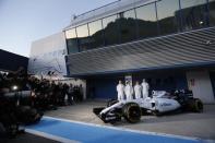 (L-R) Williams Formula One racing drivers Valtteri Bottas of Finland, Felipe Massa of Brazil, Susie Wolff of Britain and Alex Lynn of Britain pose next the new FW37 car during its official presentation at the Jerez racetrack in southern Spain February 1, 2015. REUTERS/Marcelo del Pozo