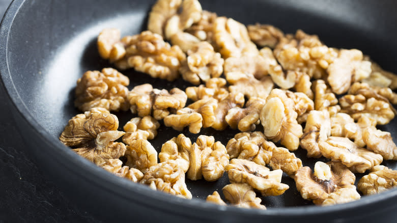 walnuts toasting in pan