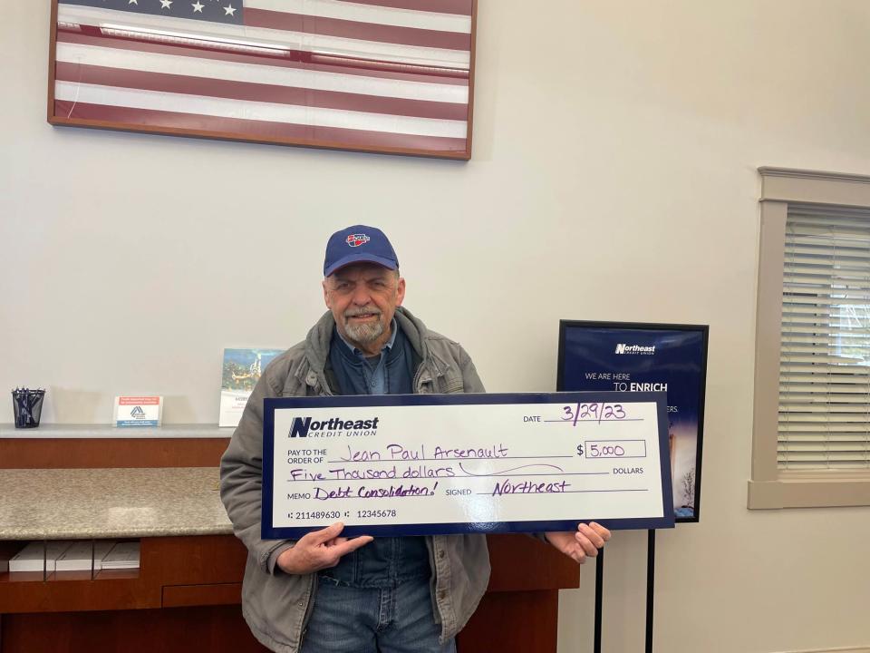 Sweepstakes Winner with Check Jean Paul Arsenault