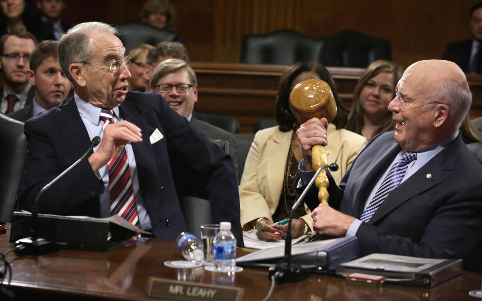 U.S. Sen. Chuck Grassley (R-Iowa), left, reacts as Sen. Patrick Leahy (D-Vt.) brings out a giant gavel while making remarks during an executive business meeting of the Senate Judiciary Committee on Jan. 22, 2015. Leahy ceremonially passed the gavel to Grassley who has taken up the chairmanship after the Republicans won the majority in the Senate.