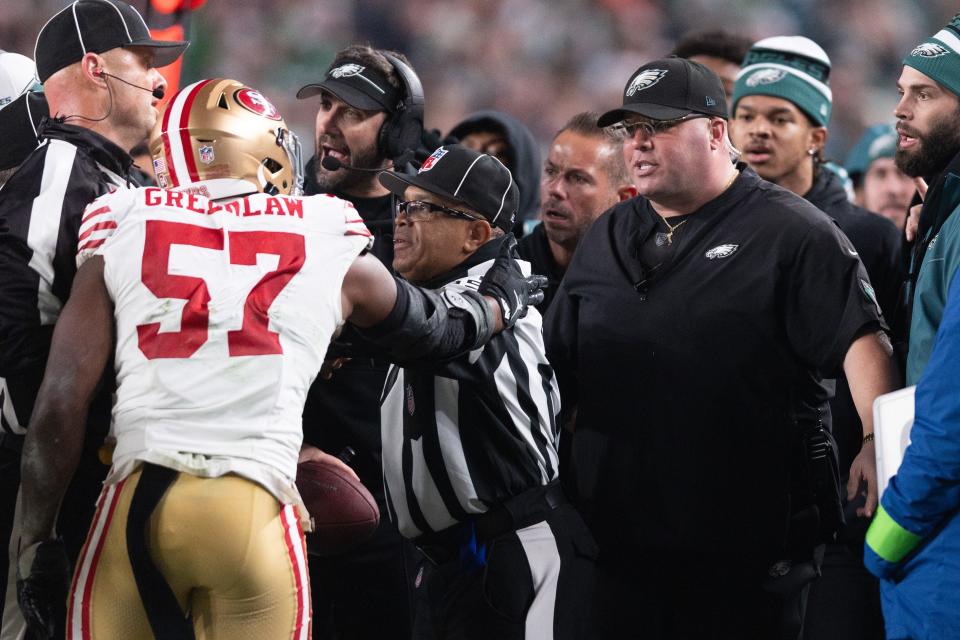49ers linebacker Dre Greenlaw (57) has an altercation with Eagles staff member Dom DiSandro during the third quarter at Lincoln Financial Field.