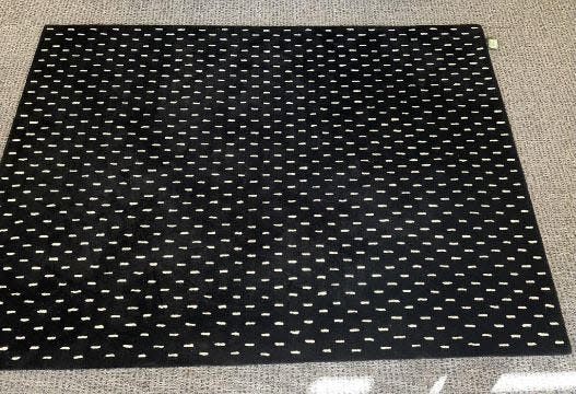 a black and white spotted rug