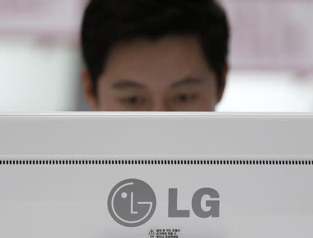 A man looks at a LG Electronics' monitor during the 2014 Korea Electronics Show in Goyang October 17, 2014. REUTERS/Kim Hong-Ji