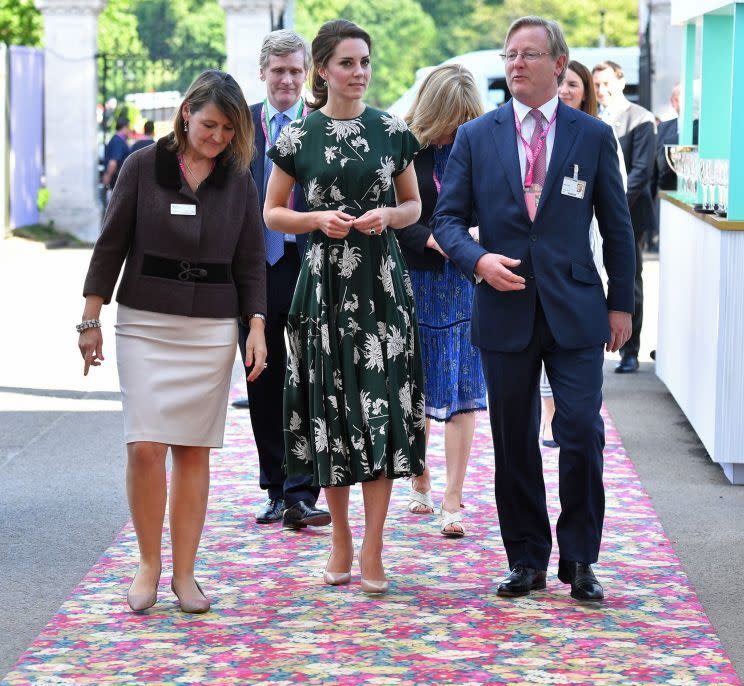 <p>The Duchess turned up to the Chelsea Flower Show appropriately dressed in a green floral design by French label Rochas. Reportedly costing £1500, the fit-and-flare style was paired with nude L.K. Bennett heels and green onyx earrings by Monica Vinader.</p><p><i>[Photo: PA]</i></p>