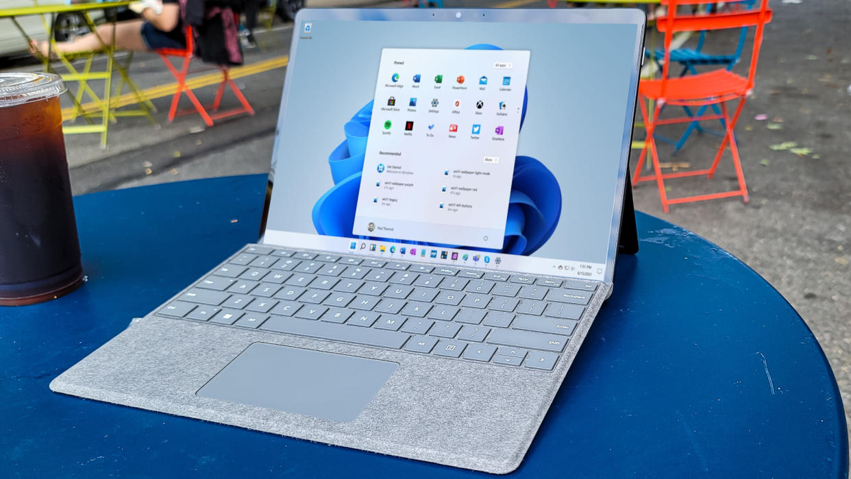  Surface Pro 8 outside on a table showing Windows 11 desktop. 