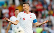 <p>Robert Lewandowksi looks as perplexed as Poland looked toothless </p>