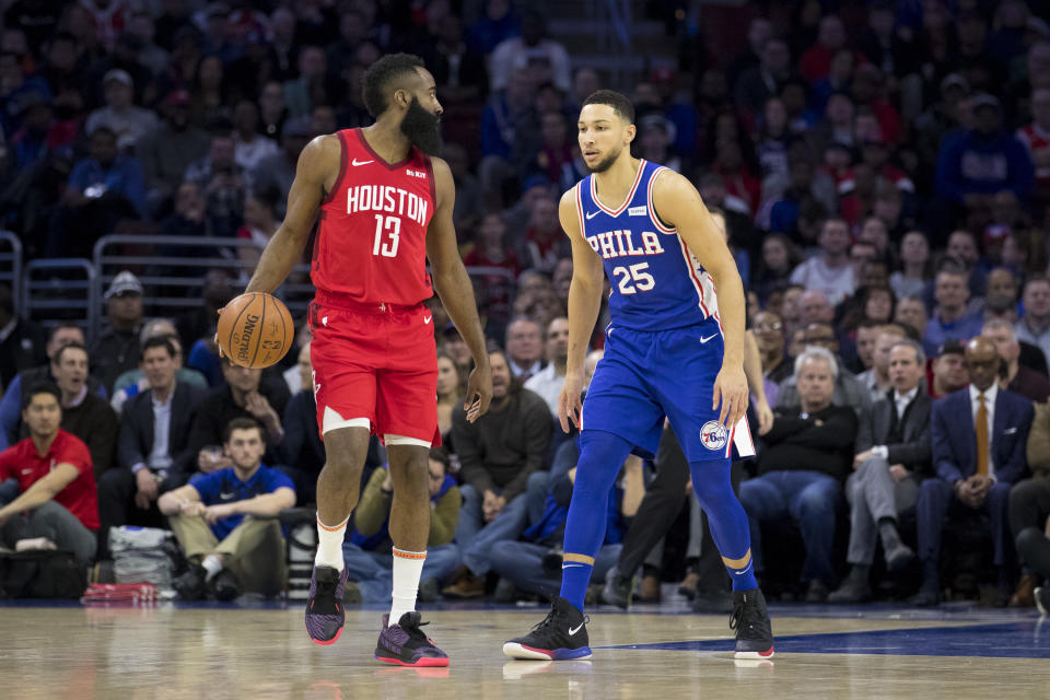 James Harden dribbles the ball against Ben Simmons.