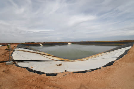 A water storage pond is seen at a wastewater injection facility operated by H20 Midstream in Big Spring, Texas U.S. February 13, 2019. Picture taken February 13, 2019. REUTERS/Nick Oxford