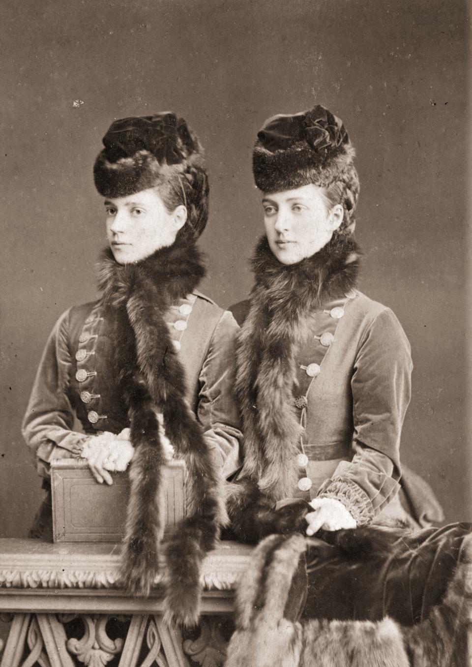 1874:  Alexandra, consort of Prince Edward (later King Edward VII) and her sister the Empress Marie Dagmar of Russia, (1847 - 1928, left), consort of Tsar Alexander III. Both women are daughters of King Christian IX of Denmark.  (Photo by Bergamasco/Hulton Archive/Getty Images)