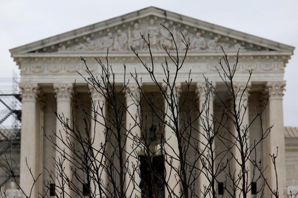 Branches slightly obscure the facade of the U.S. Supreme Court building April 07, 2023 in Washington, DC.