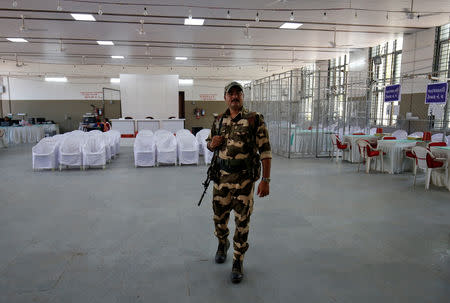 A member of Central Industrial Security Force (CISF) keeps guard inside a vote counting centre in Ahmedabad, India, May 22, 2019. REUTERS/Amit Dave