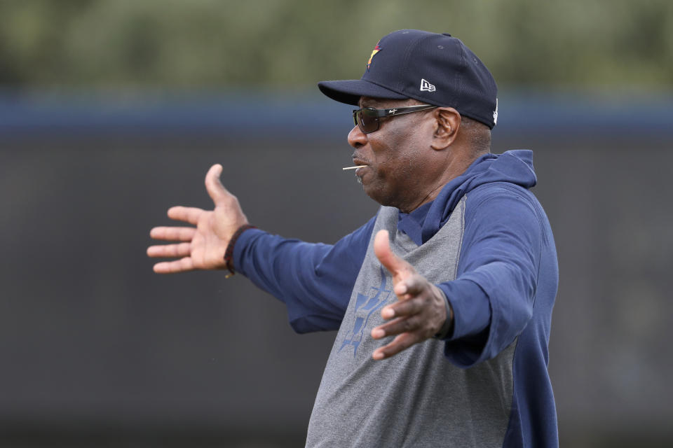 Houston Astros manager Dusty Baker gestures as he watches his team during spring training baseball practice Thursday, Feb. 13, 2020, in West Palm Beach, Fla. (AP Photo/Jeff Roberson)