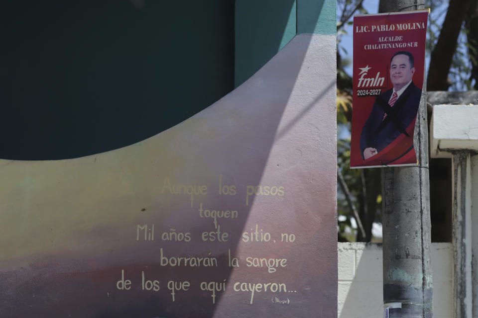 LAT PHOTO DESK EDITING THIS - A campaign sign for the new Mayor Pablo Molina, of the Farabundo Martí National Liberation Front (FMLN) party, right, hangs after elections in San Jose Las Flores, El Salvador, Wednesday, Feb. 28, 2024. The sign in front features poetry from Chile's late poet Pablo Neruda. (AP Photo/Salvador Melendez)