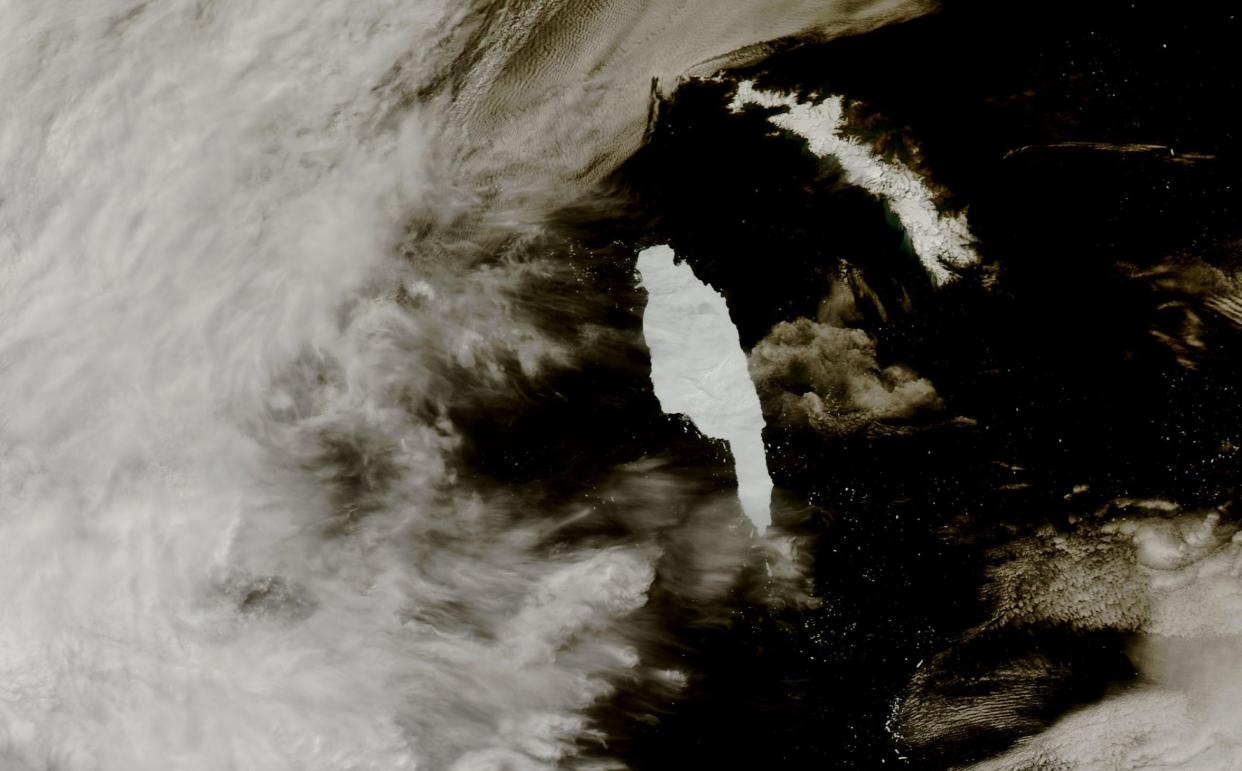 A68A iceberg approaching the island of South Georgia (14 December 2020). The left hand part of the image are clouds. Credit: MODIS image from NASA Worldview Snapshots. See SWNS story SWNNiceberg; A mega iceberg that was once three and a half times larger than London has released a whopping 152 billion tonnes of fresh water into the ocean as it melts, according to a study. Researchers say the megaberg melted the equivalent of 61 million Olympic sized swimming pools which could have a devastating impact on the marine habitats. Known as A68A it measured 5719 square kilometres, quarter the size of Wales, and melted enough water to fill Loch Ness 20 times.