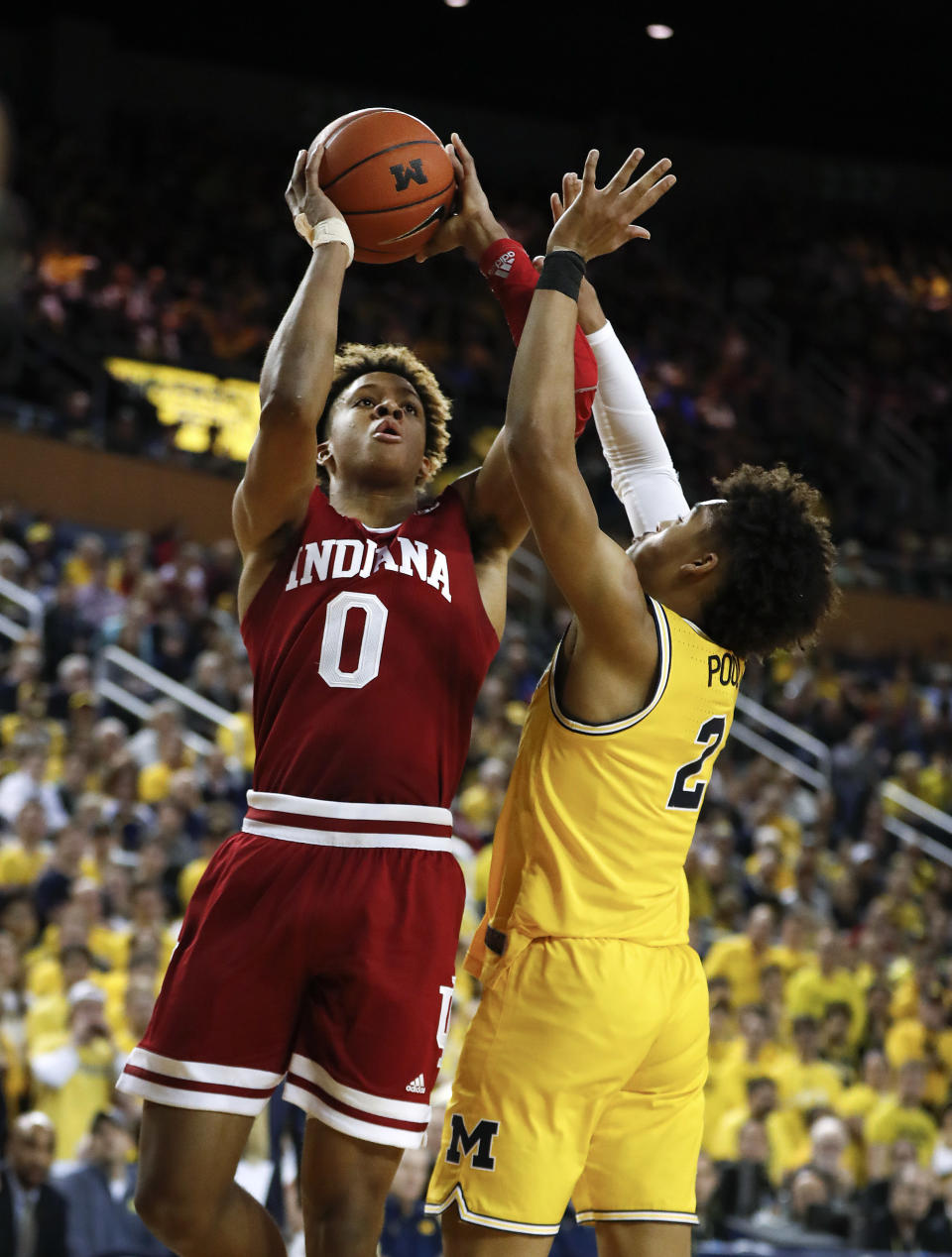 Indiana guard Romeo Langford (0) shoots on Michigan guard Jordan Poole (2) in the first half of an NCAA college basketball game in Ann Arbor, Mich., Sunday, Jan. 6, 2019. (AP Photo/Paul Sancya)