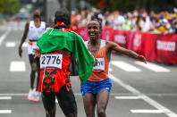 <p>Hokkaido , Japan - 8 August 2021; Abdi Nageeye of Netherlands crosses the finish line in second place as he is greeted by first place Eliud Kipchoge of Kenya during the men's marathon at Sapporo Odori Park on day 16 during the 2020 Tokyo Summer Olympic Games in Sapporo, Japan. (Photo By Ramsey Cardy/Sportsfile via Getty Images)</p> 