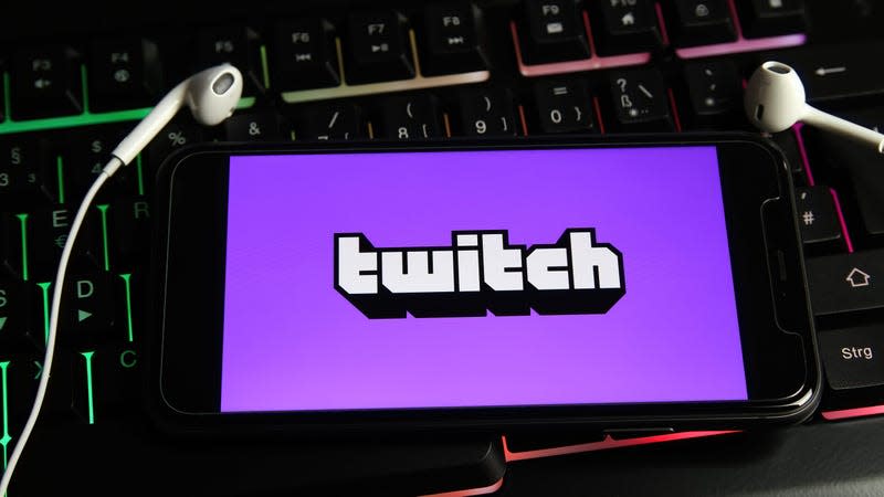 A photo of the Twitch logo on a phone screen.