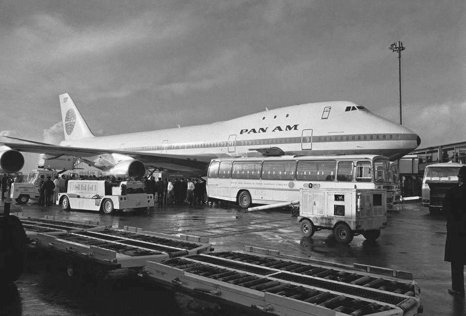 FILE - A Pan Am Boeing 747 sits at Heathrow Airport, London, after its maiden commercial trans Atlantic flight from New York, on Jan. 22, 1970. Boeing bids farewell to an icon on Tuesday, Jan. 31, 2023, when it delivers the jumbo jet to cargo carrier Atlas Air. Since it debuted in 1969, the 747 has served as a cargo plane, a commercial aircraft capable of carrying nearly 500 passengers, and the Air Force One presidential aircraft, but it has been rendered obsolete by more profitable and fuel-efficient models. (AP Photo/Lawrence Harris, File)