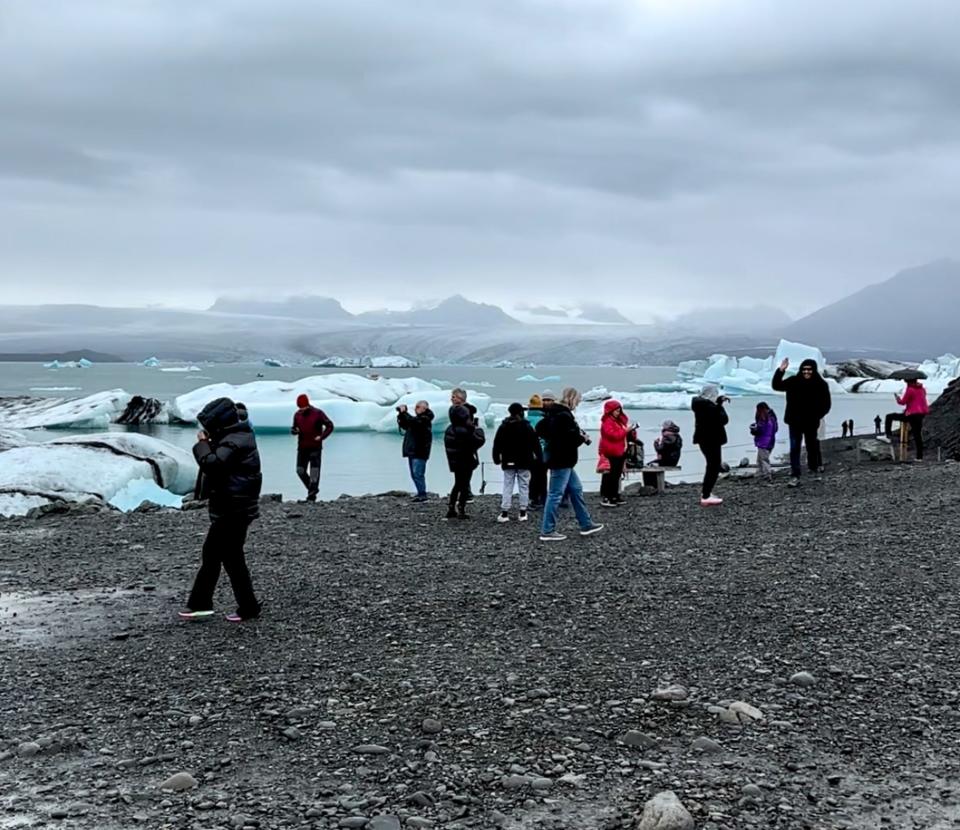 Crowds of people at a lagoon in iceland