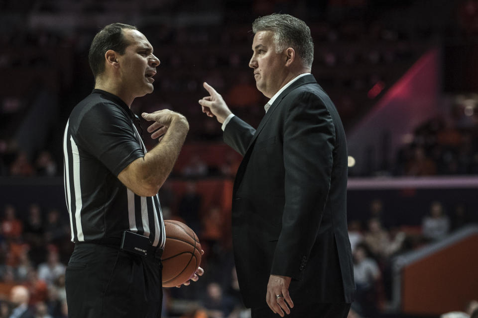 Purdue Head Coach Matt Painter makes a point with an official as Purdue takes on Illinois in the first half of an NCAA college basketball game, Sunday, Jan. 5, 2020, in Champaign, Ill. (AP Photo/Holly Hart)