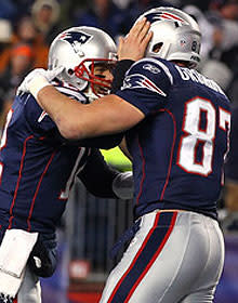 Tom Brady (left) celebrates one of his 3 TD passes to Rob Gronkowski