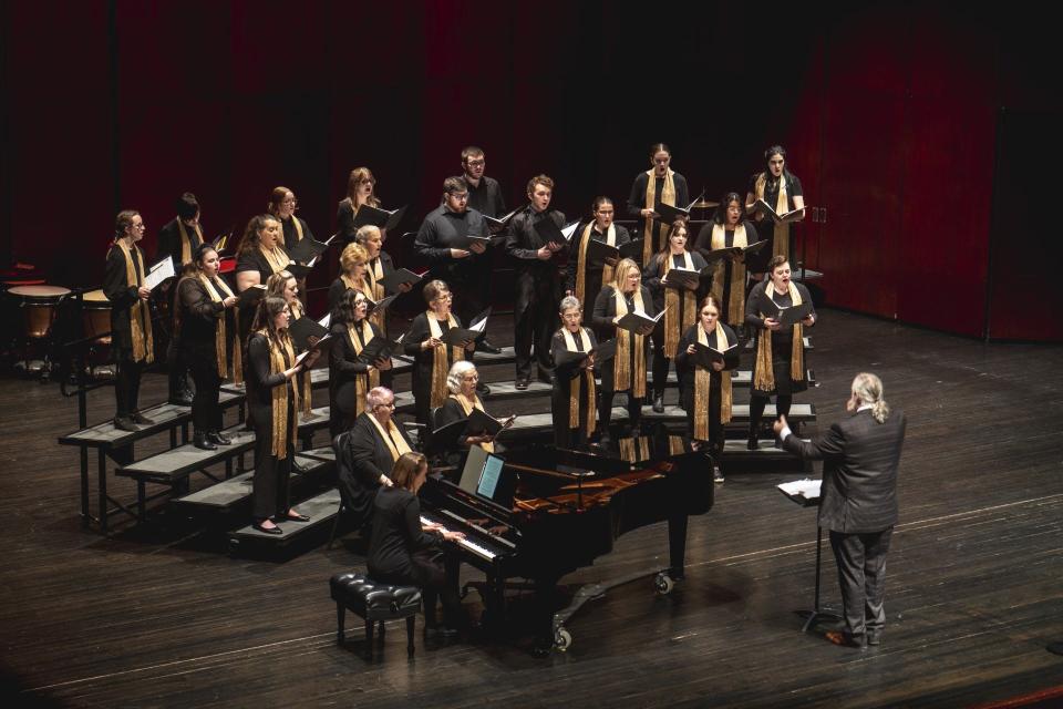 Jonathan Lunneberg is shown directing the Agora Chorale.