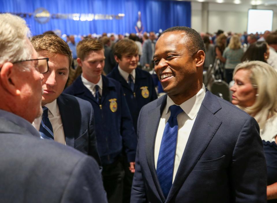 Kentucky Attorney General Daniel Cameron stops and speaks with a constituent at the annual Kentucky Farm Bureau Country Ham Breakfast at the Kentucky State Fair on August 24, 2023