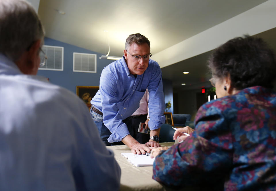 Democratic Congressman Scott Peters checks in at a polling station before voting during the U.S. midterm elections in La Jolla, California November 4, 2014.    REUTERS/Mike Blake (UNITED STATES - Tags: POLITICS ELECTIONS)